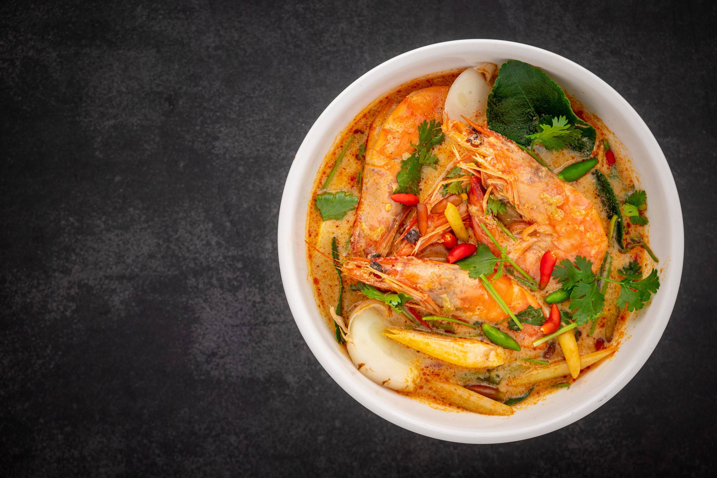 Tom Yum Goong Being Served In A Bowl